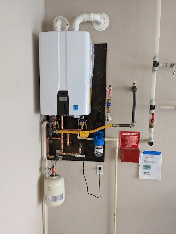 Professional plumber installing copper piping in a Basalt home